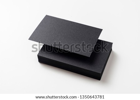 Design concept - perspective view of black business card isolated on white background for mockup, it's real photo, not 3D render