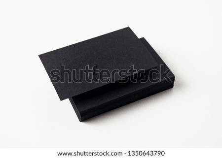 Design concept - perspective view of black business card isolated on white background for mockup, it's real photo, not 3D render