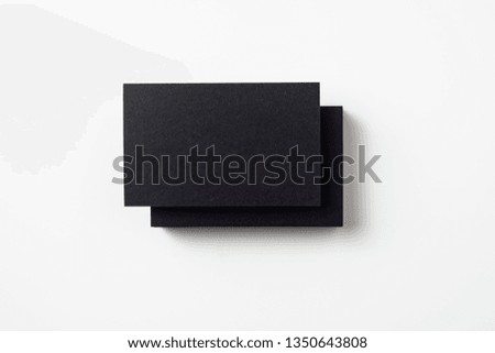 Design concept - top view of 2 black business card isolated on white background for mockup, it's real photo, not 3D render