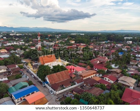 Aerial shot of common Thai public temple with street market at Asian countryside