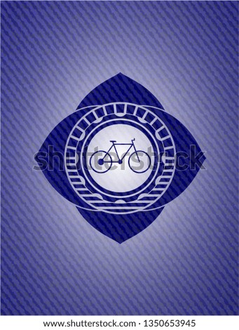 bike icon inside emblem with jean texture