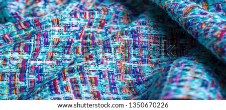Background texture, pattern. Winter fabric, warm. big braided thread. Blue-red yellow threads. This photo will make your design the best. Wallpapers, pictures, posters.