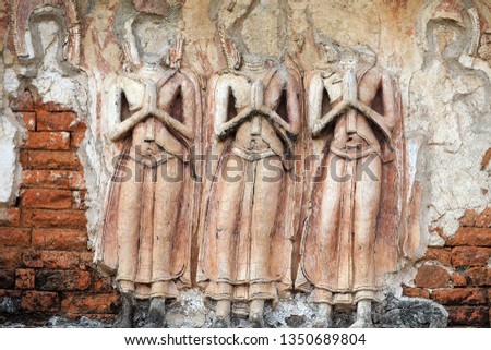 An ancient low relief decorated on the pagoda at Wat Pra Sri Mahatat in Lopburi