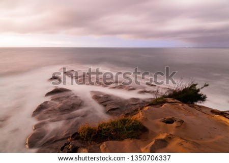 Long exposure of rocks by the sea