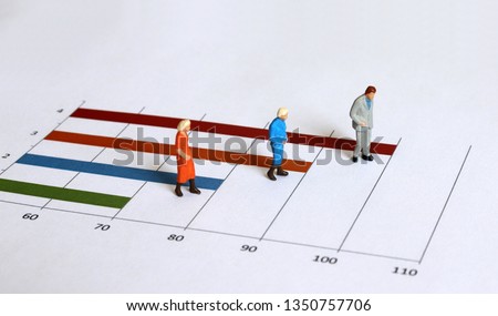 Miniature old people walking on the graph. The concept of an aging society. Royalty-Free Stock Photo #1350757706