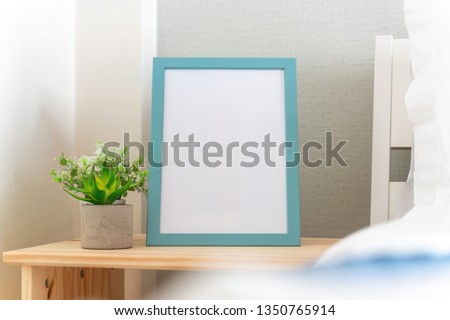 photo frame is beside the bed in the bedroom ,interior design home real estate 