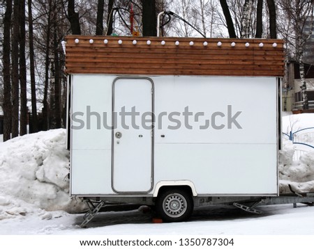 White trailer on wheels with door Royalty-Free Stock Photo #1350787304