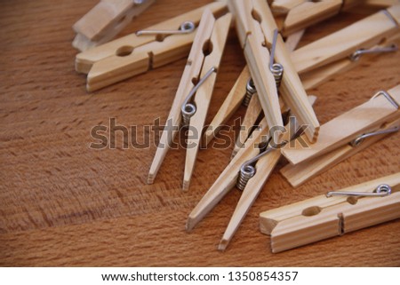 wooden clothespins on the table