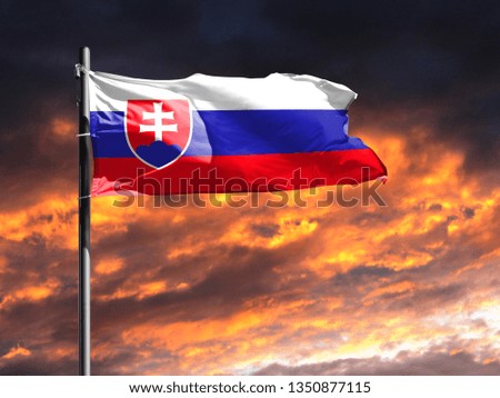 flag of Slovakia on flagpole fluttering in the wind against a colorful sunset sky