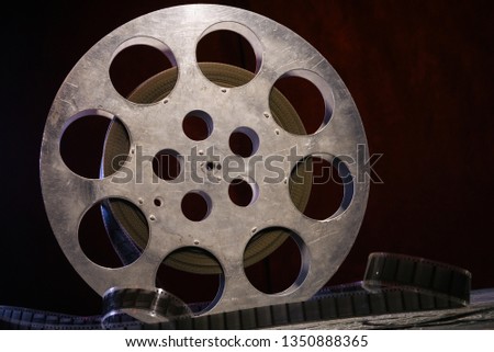  film reel with dramatic lighting on a dark background - image