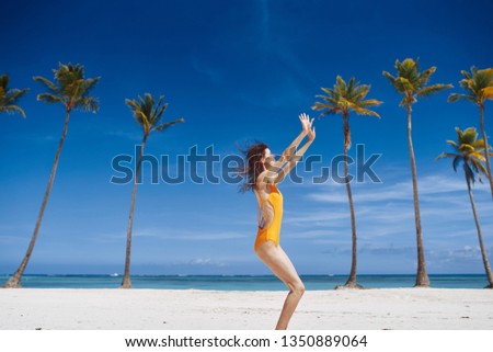 Woman dancing in the sand                          