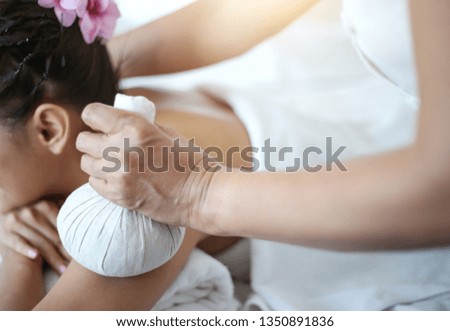 Body care. Spa body massage treatment with hot herbal ball for deep relaxation