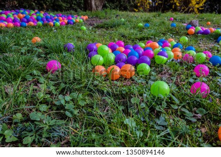 Several colorful ball pits for kids on the floor outdoor