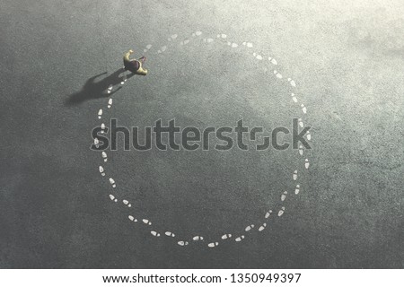 man following his footsteps in circle; life concept Royalty-Free Stock Photo #1350949397