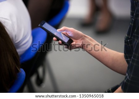 close up investor man hand gesture hold mobile phone device for reading or write digital content concept.