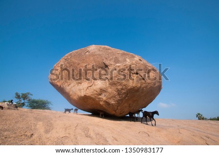 Krishna's butterball, the giant natural balancing rock in Mahabalipuram, Tamil Nadu, India  Royalty-Free Stock Photo #1350983177