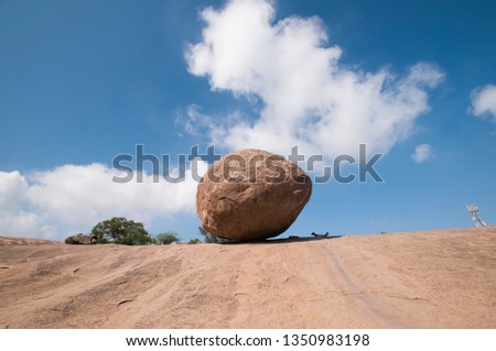 Krishna's butterball, the giant natural balancing rock in Mahabalipuram, Tamil Nadu, India  Royalty-Free Stock Photo #1350983198