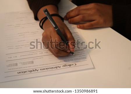 Columbus,Ohio/USA March 24, 2019:  Young woman making application for College admission. Royalty-Free Stock Photo #1350986891