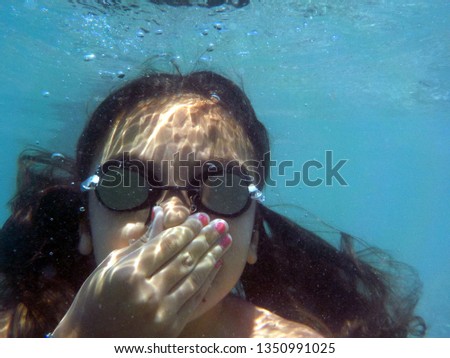 take a dive underwater holding your breath Royalty-Free Stock Photo #1350991025