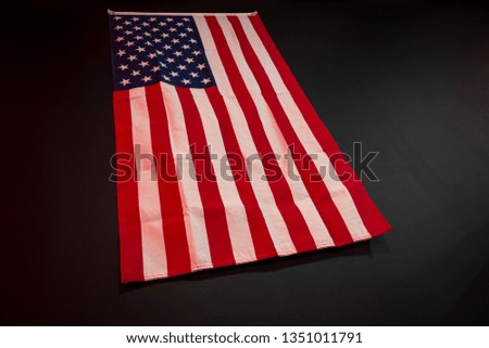 American flag on the black wall