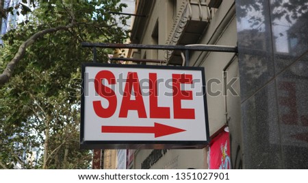 Sale sign in a commercial precinct            