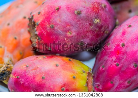 Abstract and closeup of red prickly pears. Red and yellow. Fruit typical of Sicily and the Mediterranean. Rich in fibers, vitamins and minerals.
