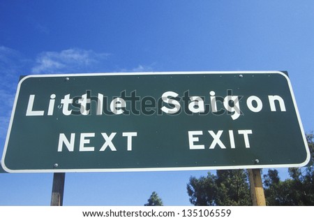 Low angle view of Little Saigon; Next Exit sign