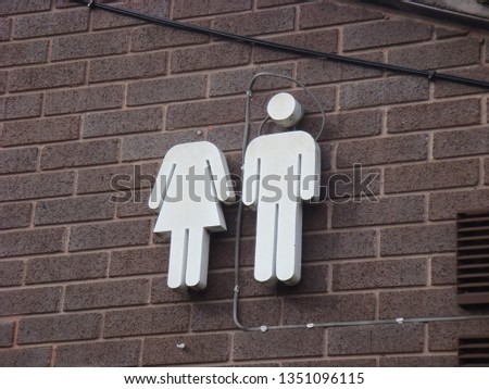 Male female toilet sign with figures