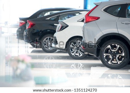 White floor for new car parking, new car pictures in the showroom, park, show waiting for sales of branch dealers and new car service centers. Royalty-Free Stock Photo #1351124270