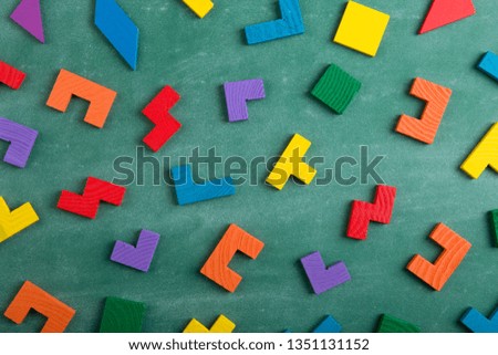 Creative solution for idea - business concept, jigsaw puzzle on the green blackboard