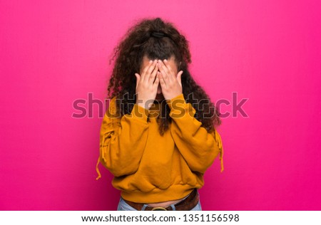 Teenager girl over pink wall with tired and sick expression