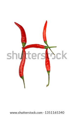 Alphabet of hot spice cayenne chili peppers isolated on white. Natural vegetarian diet organic vegetable chili peppers in shape of letter H, for making words and using as a logo