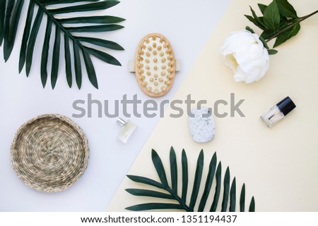 Flat lay comestic and flowers Royalty-Free Stock Photo #1351194437