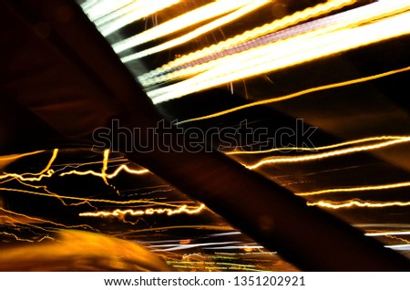 Abstract shot of city and traffic lights from inside of the car. Concept of speed, fast motion and time traveling
