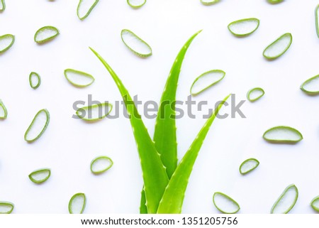 Aloe vera slices on white background.
