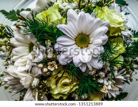 Festive bouquet of white gerberas, and daisies, yellow roses and asparagus