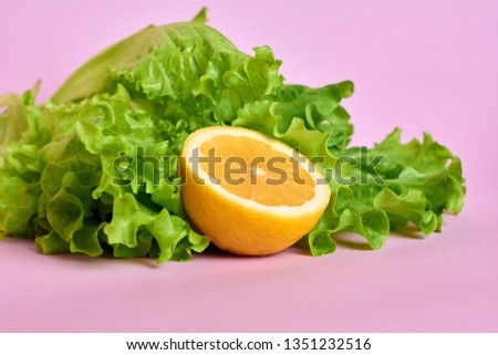 Lemon in salad. Fresh Vegetables
