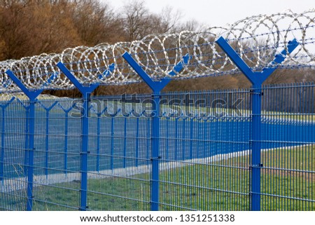 fence with the barbed wire