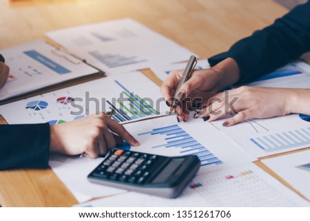 Businesswoman pointing pen on business document at meeting room.Discussion and analysis data charts and graphs showing the results at meeting. Royalty-Free Stock Photo #1351261706