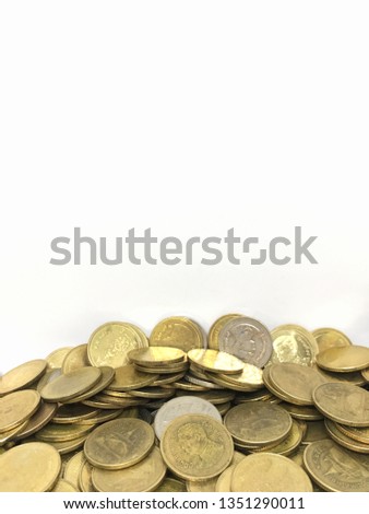 silver and gold coins on white background