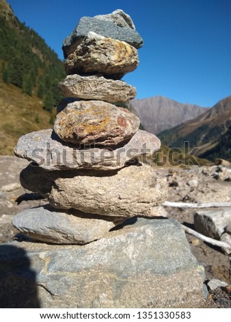 Stone tower with mountain backdrop