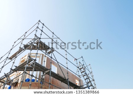 House under construction, scaffolding