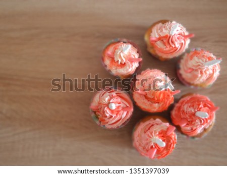 Delicious colorful cupcakes -unicorns with cheese cream for children's birthday. Layout picture.