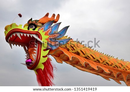Dragon dance performance on the occasion of Nian Li. Dragon dance is a form of traditional dance in Chinese culture. It symbolizes the imagined movements of the river spirit in a sinuous manner.