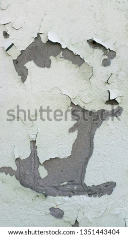 Plaster. Old destroyed plaster. Vintage background of weathered peeling plaster. Wall with sprinkled plaster