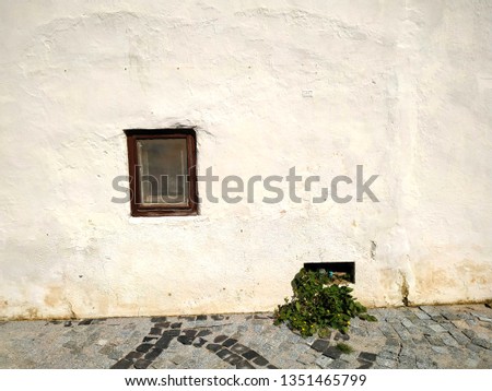 aegean - datca resadiye village. old traditional stone home window and plantlet.