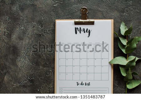 Flat lay calendar with eucalypt  leaves  on gray background. May 2019. top view.