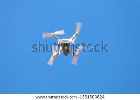 Flying drone with blue sky background, new technology