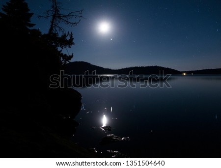 moon over Paulina Lake at night