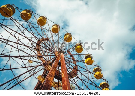 Abandoned amusement park in the city center of Prypiat in Chornobyl exclusion zone. Radioactive zone in Pripyat city - abandoned ghost town. Chernobyl history of catastrophe Royalty-Free Stock Photo #1351544285